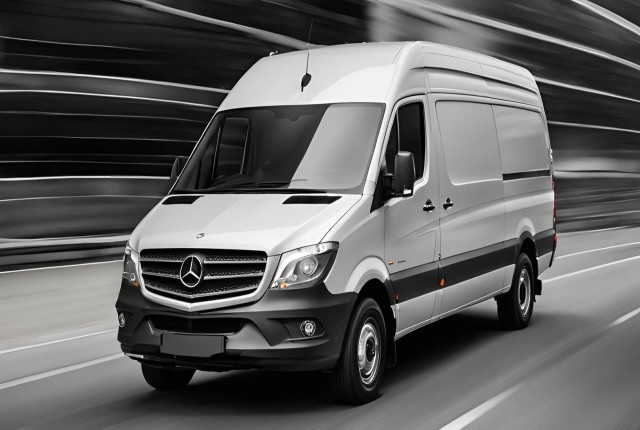 A Mercedes-Benz Sprinter van is captured in motion, showcasing its sleek design and dynamic performance on the road.